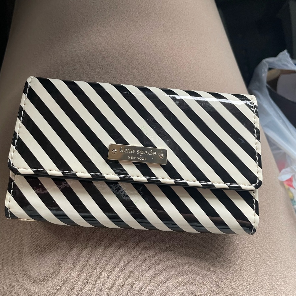 Kate Spade cardholder phone case with black and white stripes